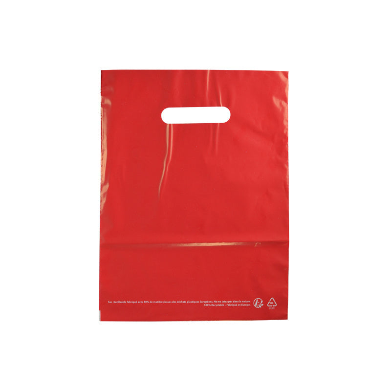 Sac plastique rouge | PEBD recyclé | poignées découpées | 25x32cm | par 1000